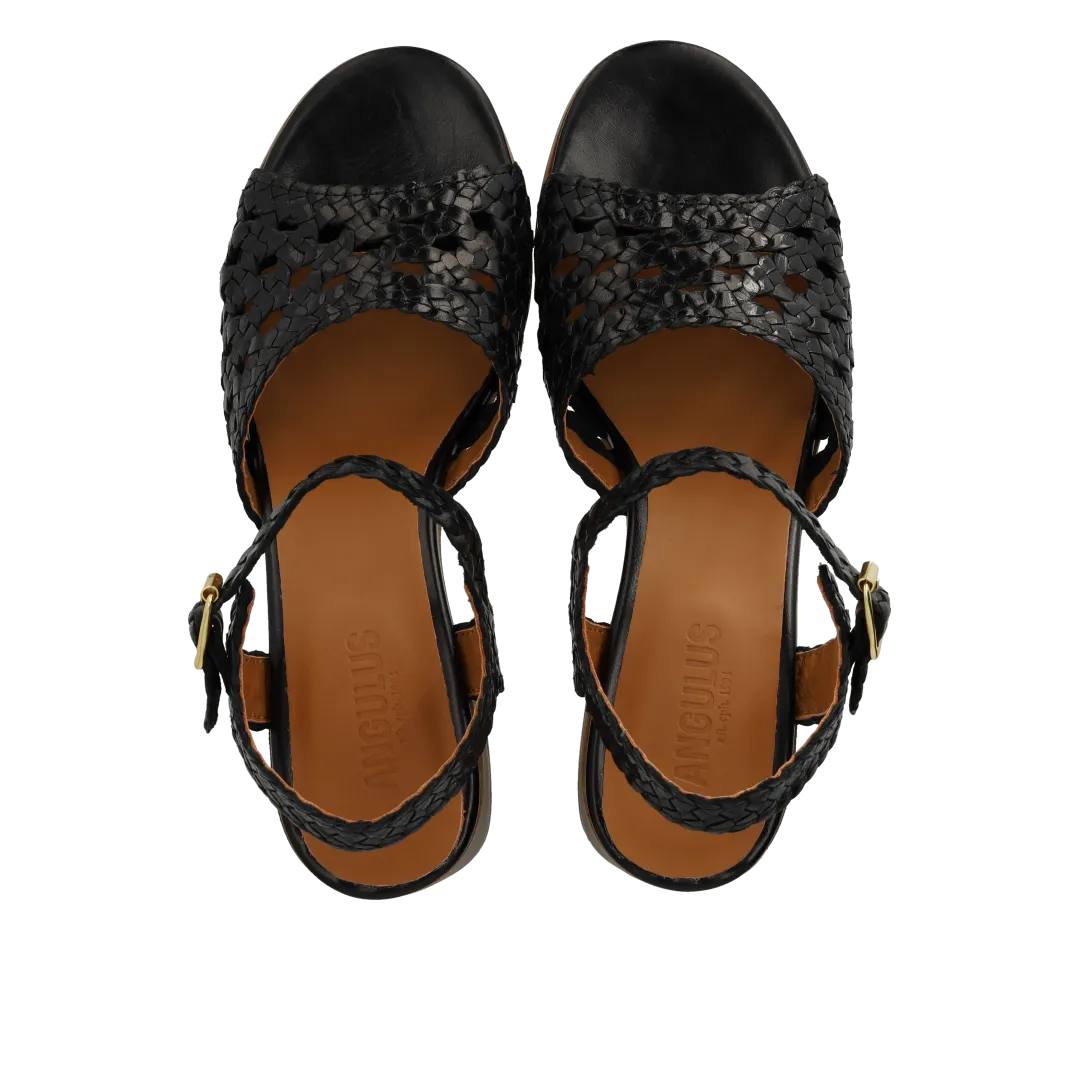 Hand-braided sandal with sculptural heel